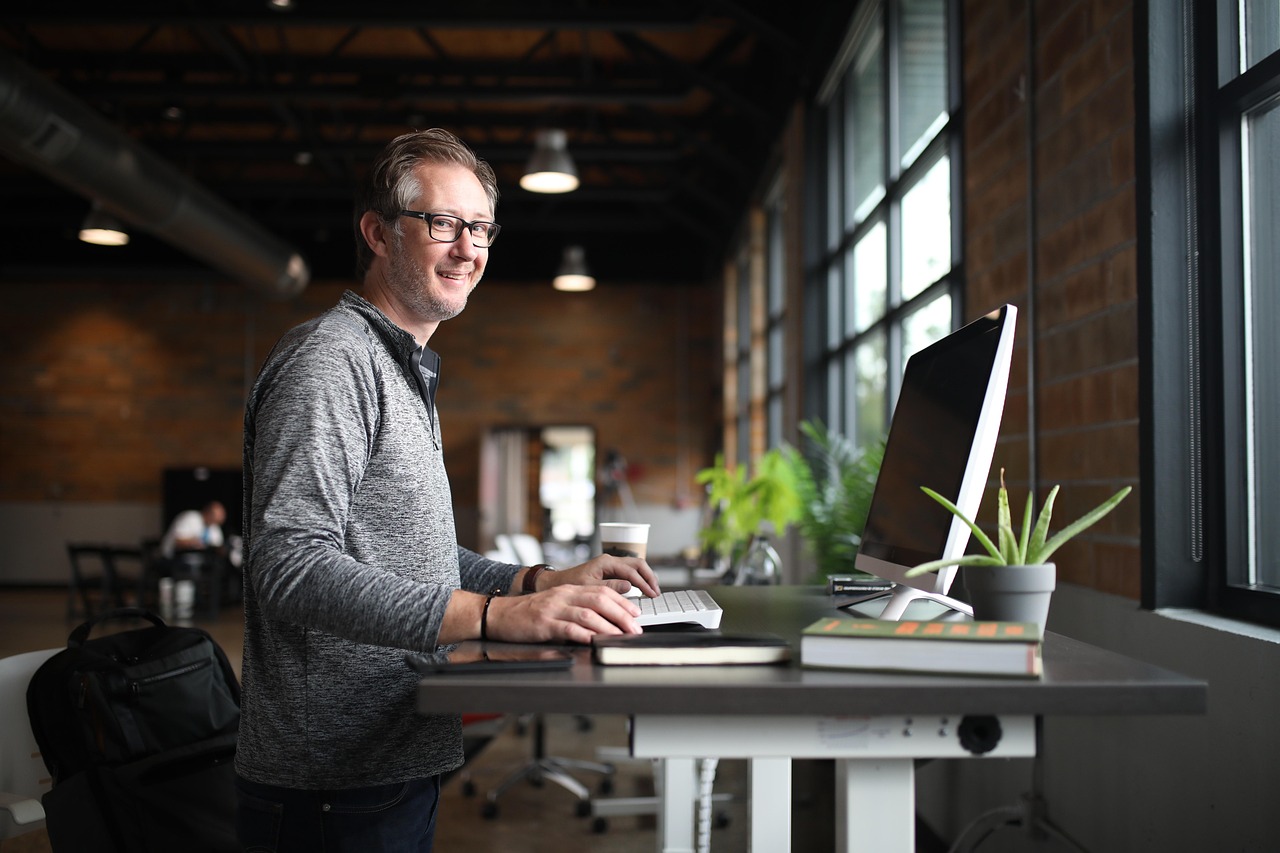 Professional business person on office desktop phone